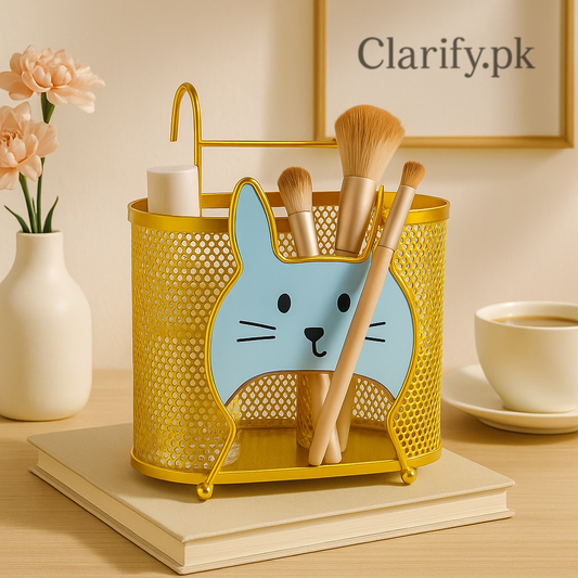 Golden bunny organizer from Clarify.pk holding makeup brushes and cosmetic items on a desk