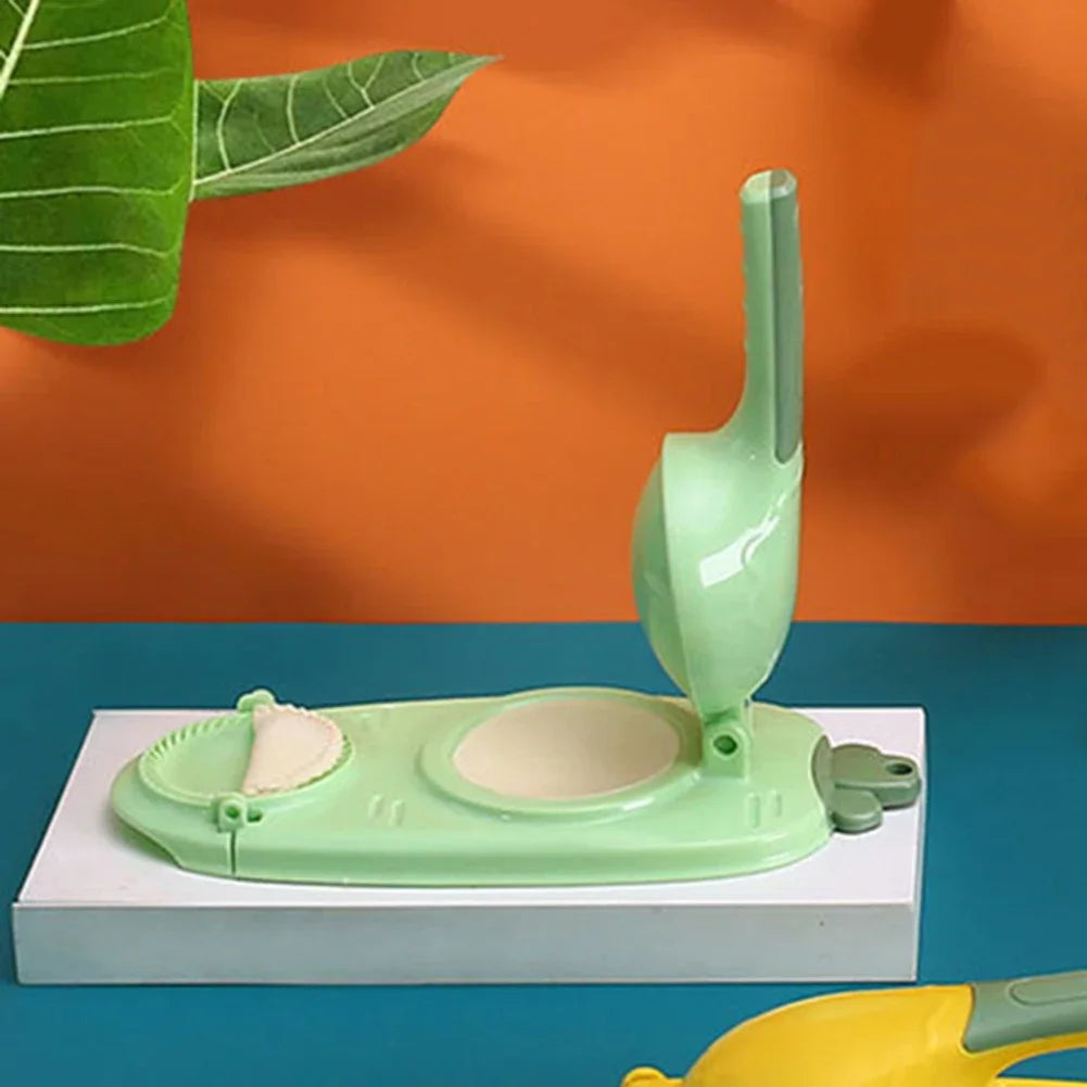 Clarify.pk green 2 in 1 dumpling mold and cookie mold with ergonomic handle on blue and orange background