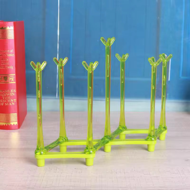 Clarify.pk green glass cup drying rack with multiple prongs for organized glassware drying