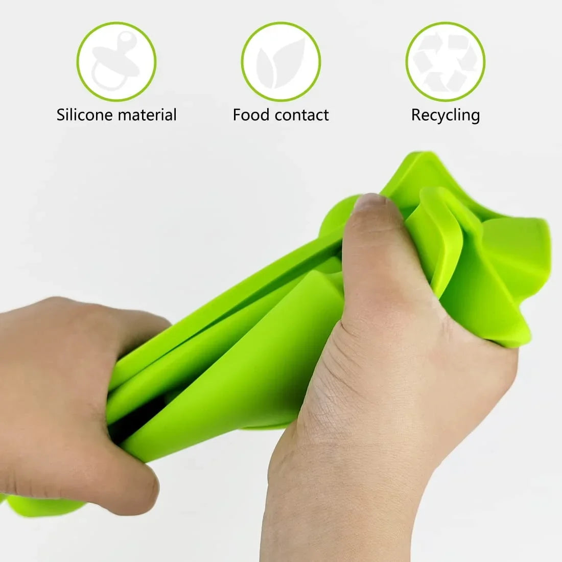 Green flexible silicone kitchen spoon holder being bent by hands showing soft material