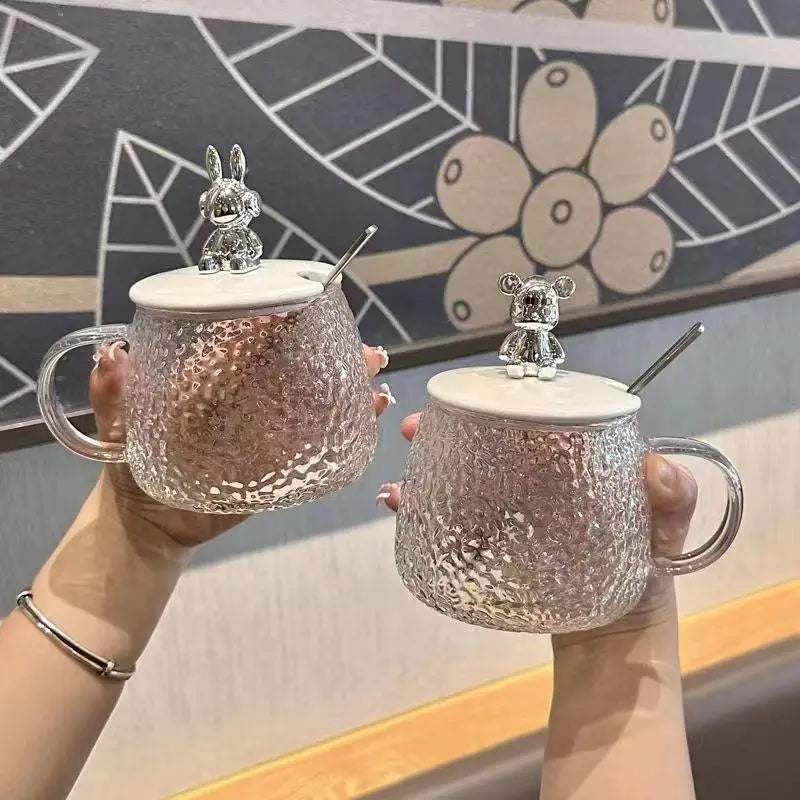 Clarify.pk hammered glass coffee cup with lid featuring textured design and cute animal-shaped handles