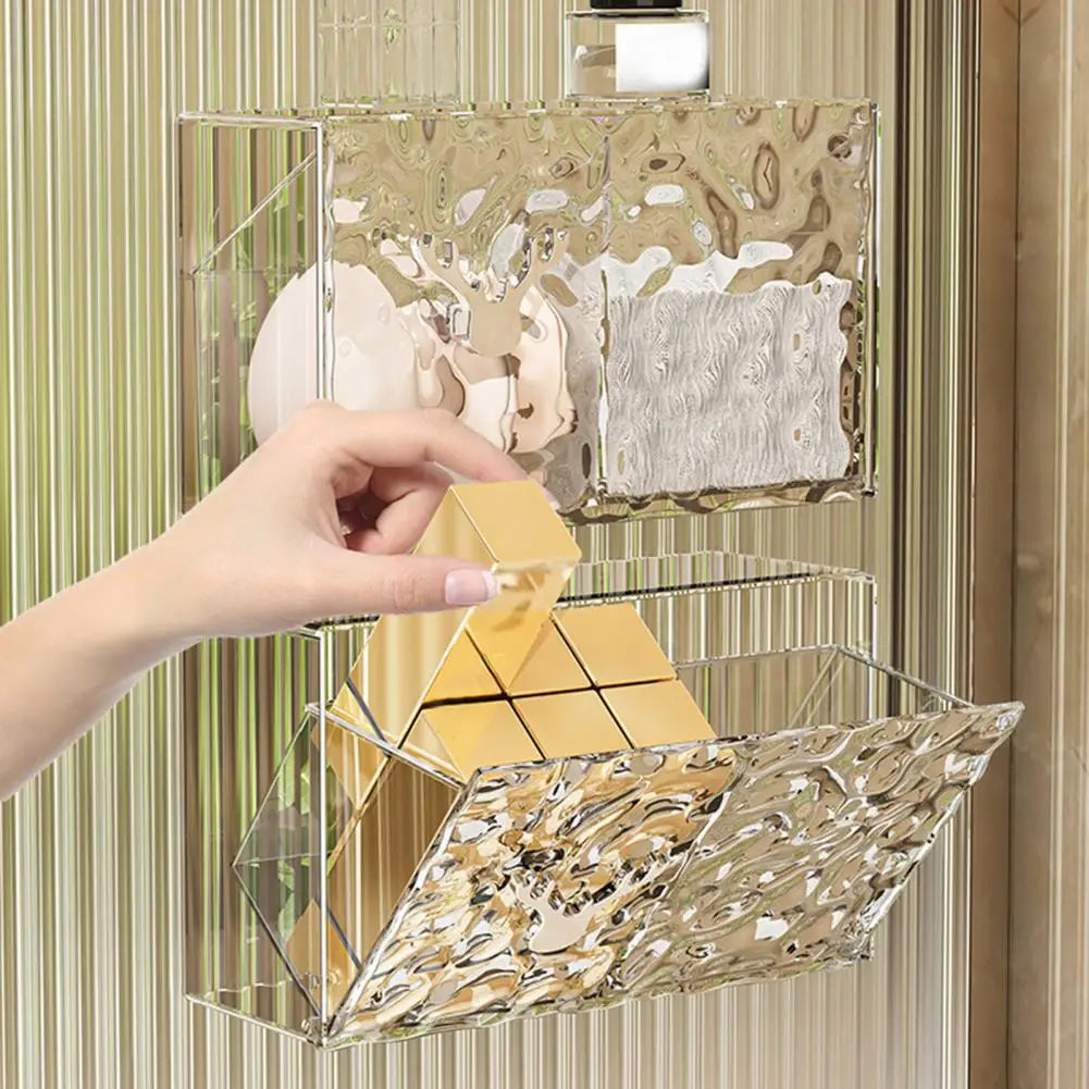 Clear acrylic cotton pad storage container wall-mounted with textured design holding gold boxes
