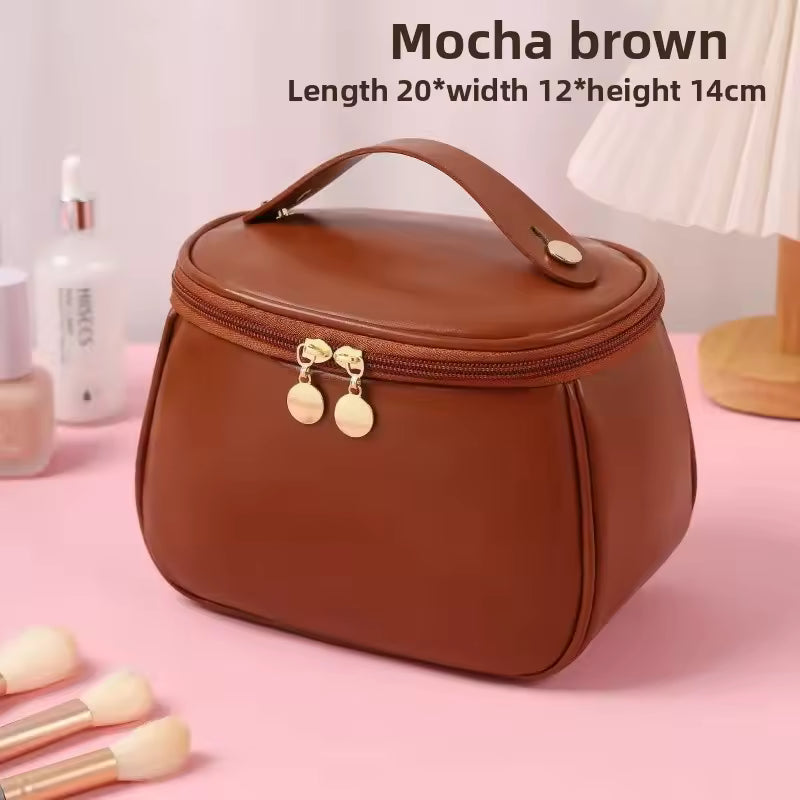 Mocha brown PU leather handheld makeup wash bag with zipper and handle from Clarify.pk