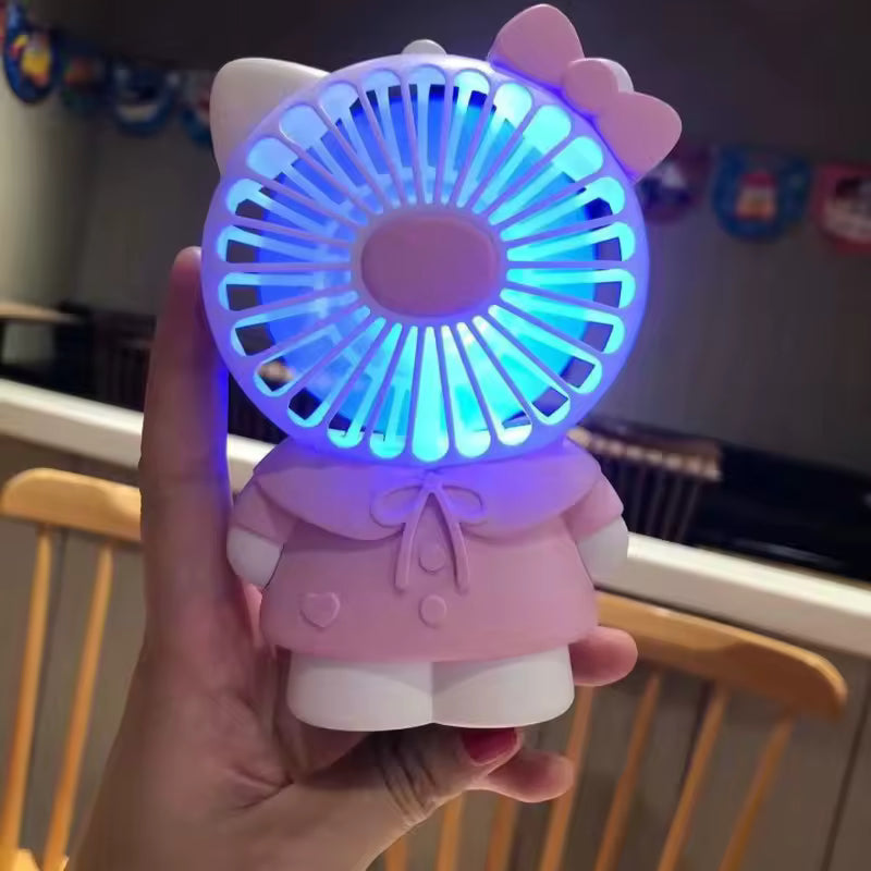 Clarify.pk Hello Kitty handheld fan in pink with blue light held in hand showing mechanical animal design
