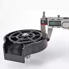 High pressure cup washer tool with measuring caliper showing precise dimensions in black plastic