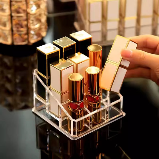 Clear 9 grid lipstick holder with multiple lipsticks organized on a glossy black surface