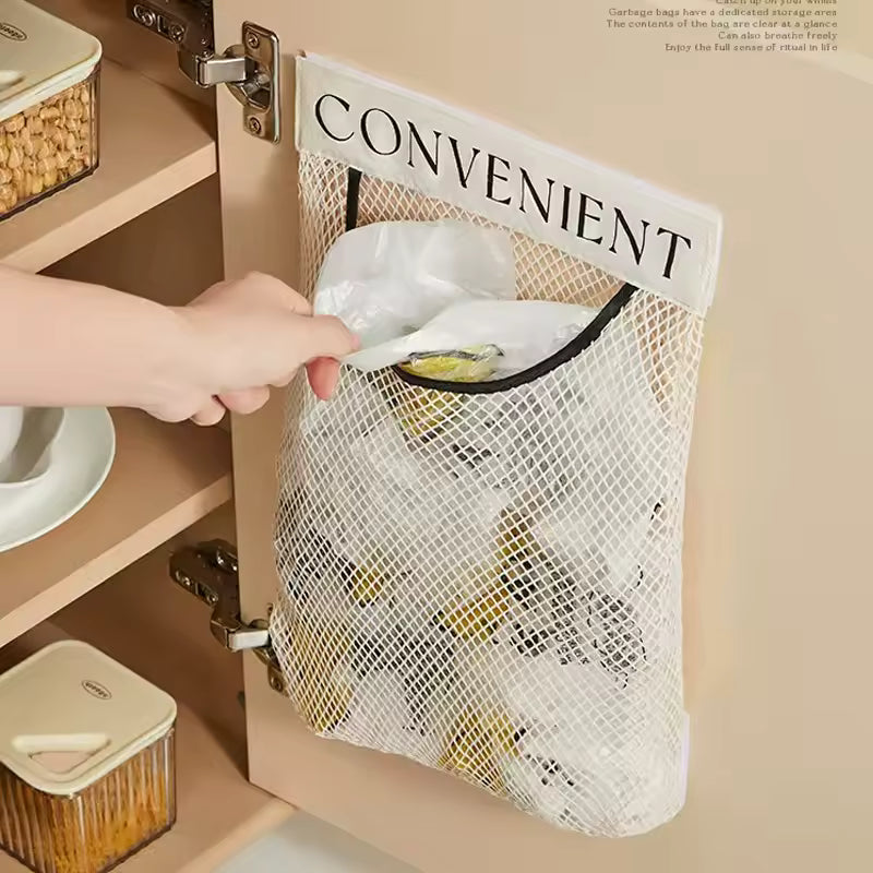 Clarify pk mesh hanging cabinet bag labeled CONVENIENT with hand pulling a plastic sack garbage bag dispenser organizer