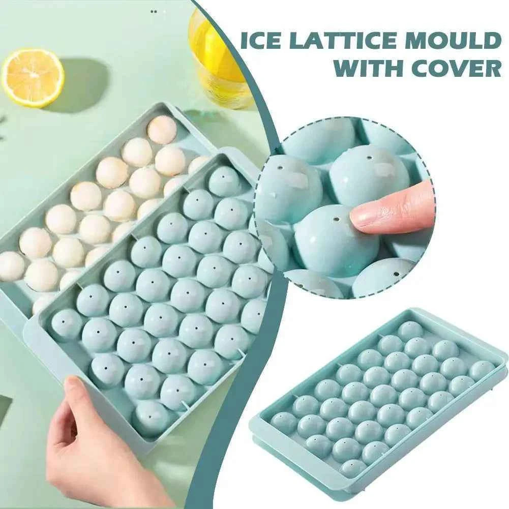 Round ice cube tray in mint green with cover, perfect for making sphere-shaped ice cubes