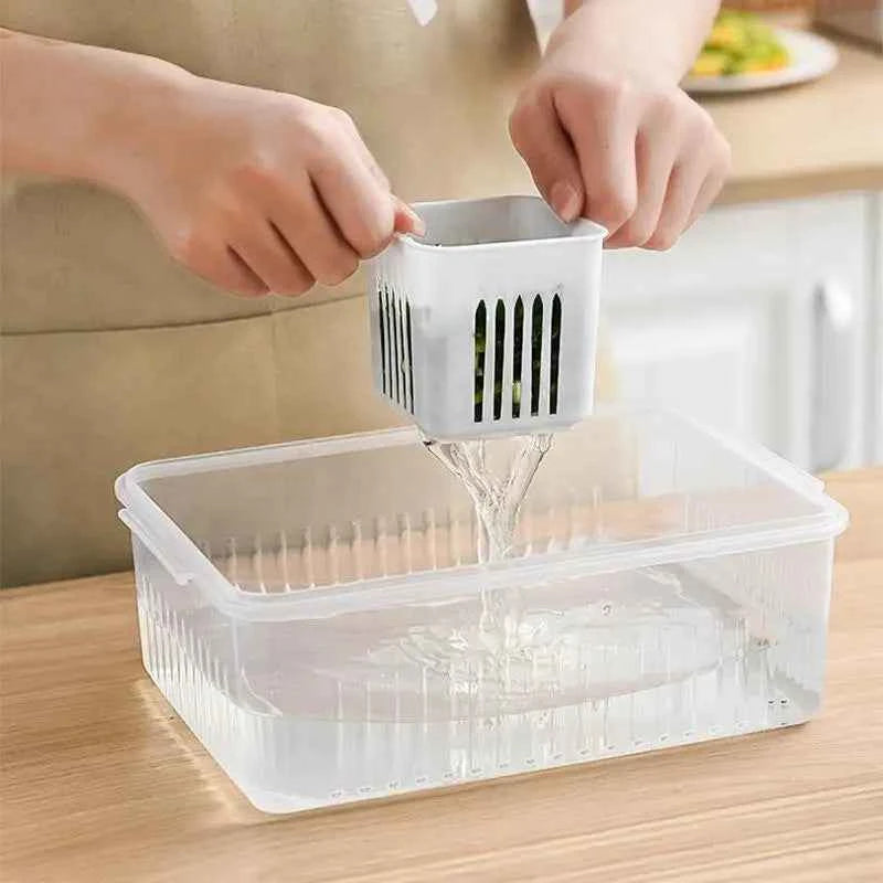 Transparent fridge organizer container with drained water for efficient food storage