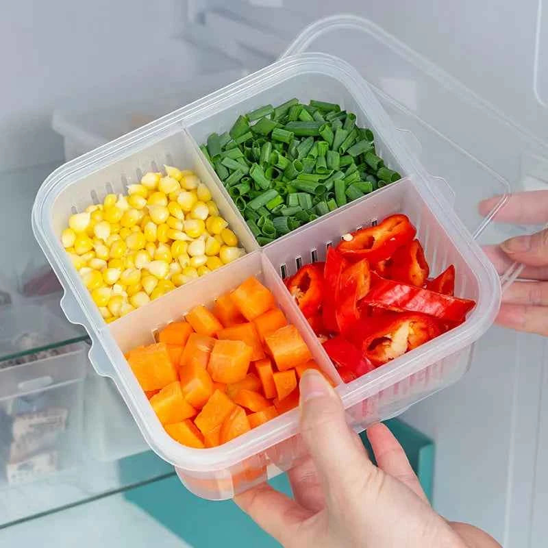 Clear fridge organizer container with four compartments for storing chopped vegetables