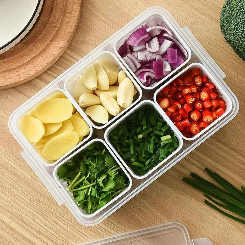 Clear fridge organizer container with six compartments for storing sliced vegetables and herbs neatly
