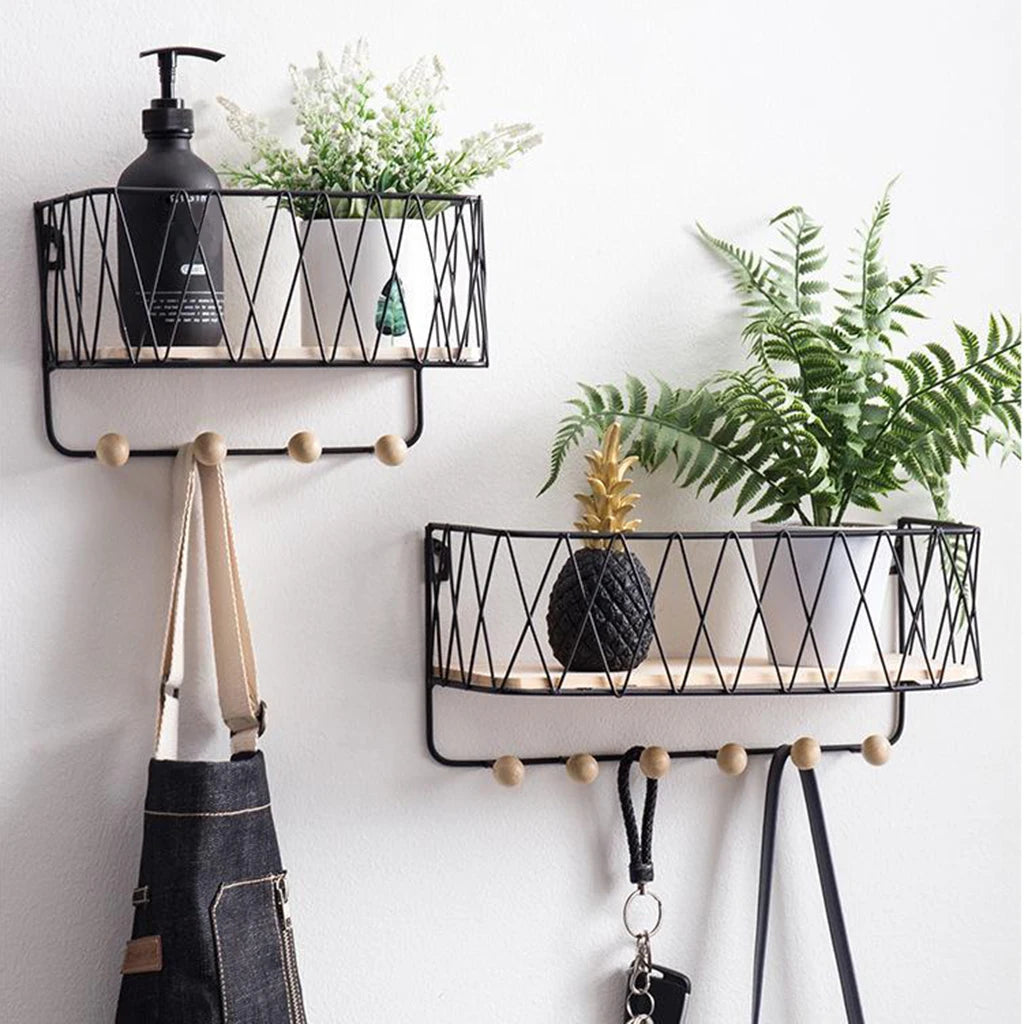 Black metal key holder wall rack with hooks featuring wooden peg hooks and storage shelves for plants and accessories