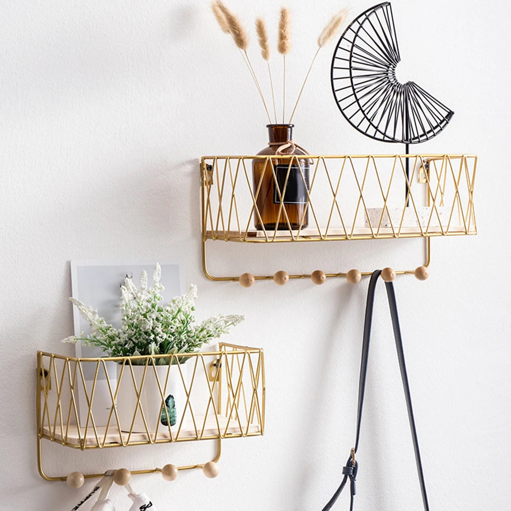 Elegant gold key holder wall rack with hooks featuring wooden knobs and decorative shelves for home organization