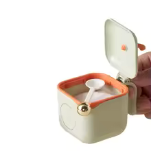 3 piece spice container set for kitchen shown open with a included spoon inside the white box