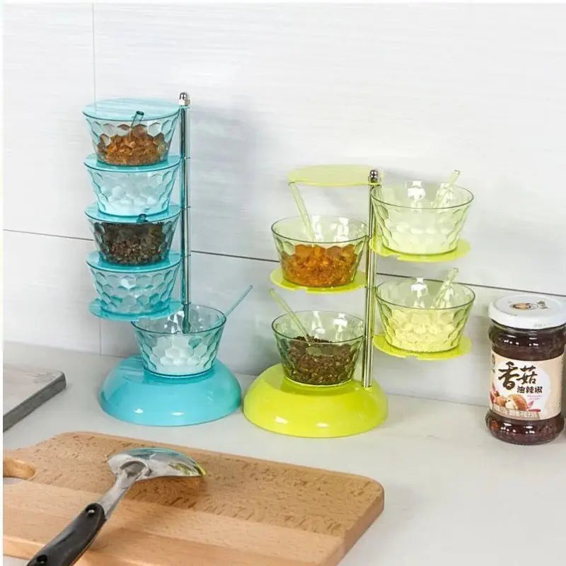 Clarify.pk 5 layer spice organizer with blue and yellow glass spice and pepper shakers on kitchen counter