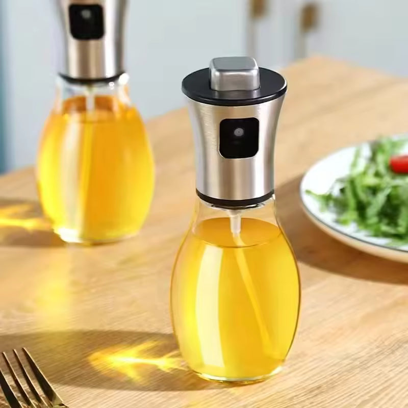 Clarify.pk kitchen oil sprayer for cooking with stainless steel top and clear glass container on wooden table