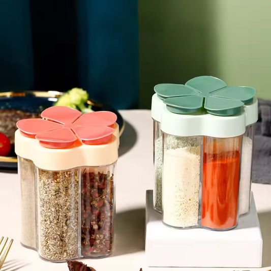 Clarify.pk kitchen seasoning container with lids in pink and green holding various spices on a white surface
