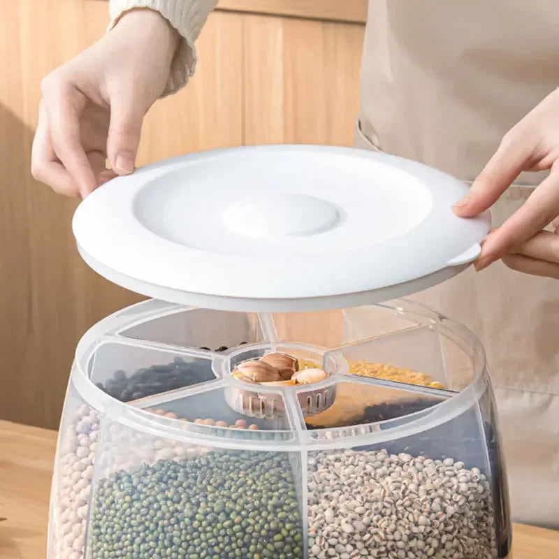 Clear 10KG kitchen storage container with multiple compartments and white lid being opened