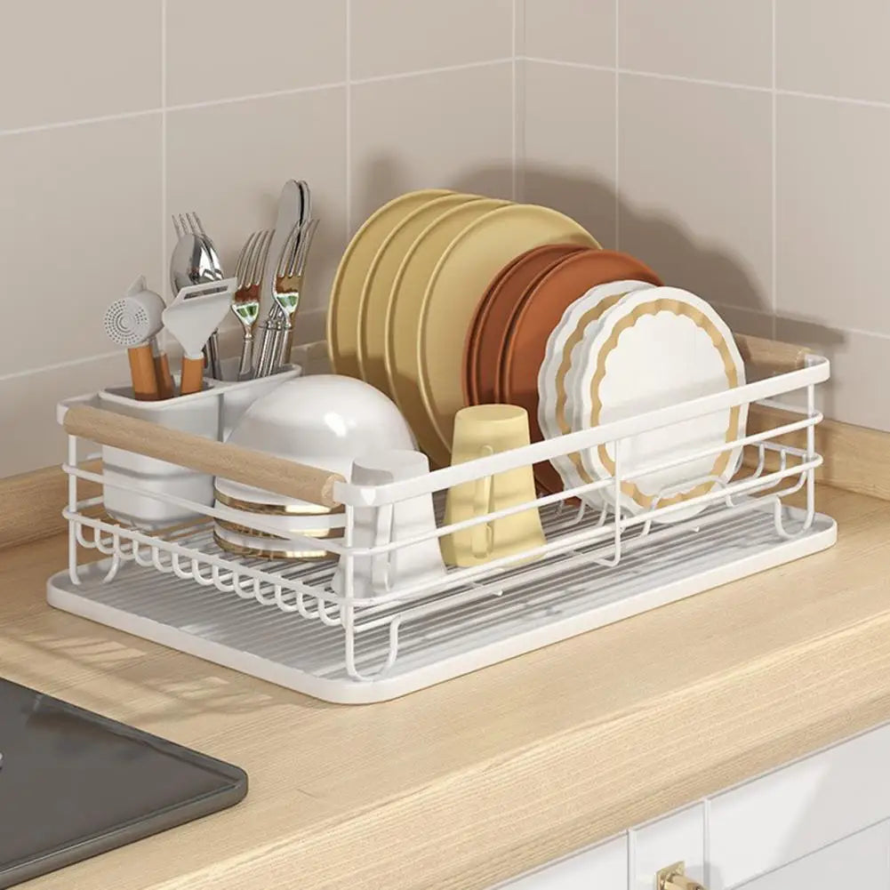Iron frame kitchen storage rack with wooden handles holding plates, bowls, and utensils on a countertop