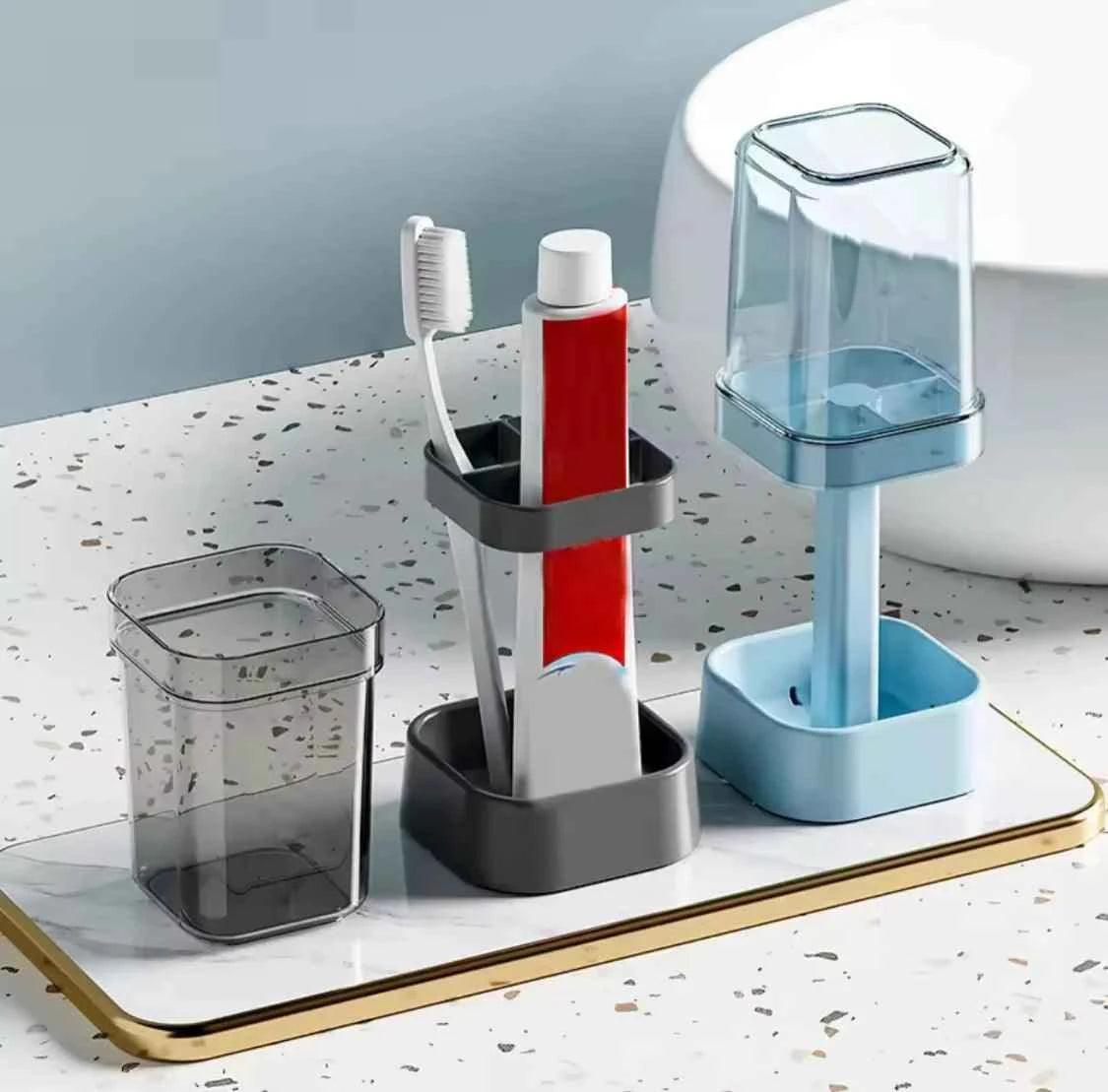 Modern lamp shaped toothbrush holder set with cups and toothpaste on bathroom countertop