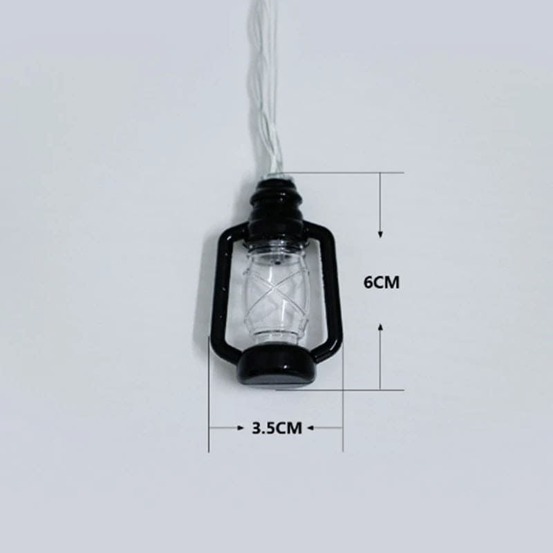Black lantern string lights set with clear bulb detailing and measurements 6cm by 3.5cm