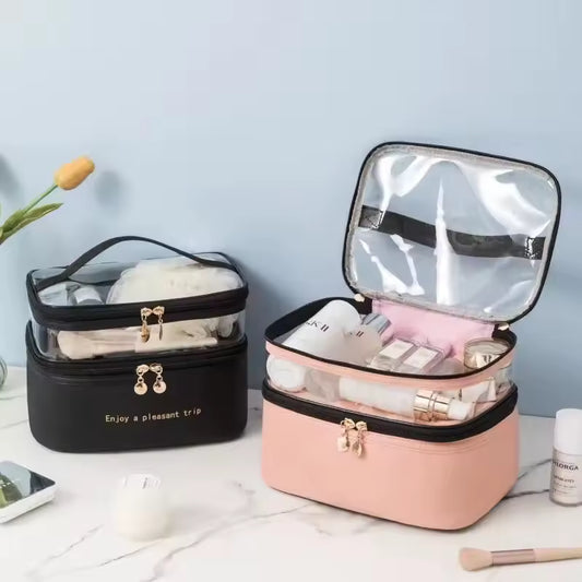 Large capacity makeup organizer in black and pink with clear top compartments and gold zippers