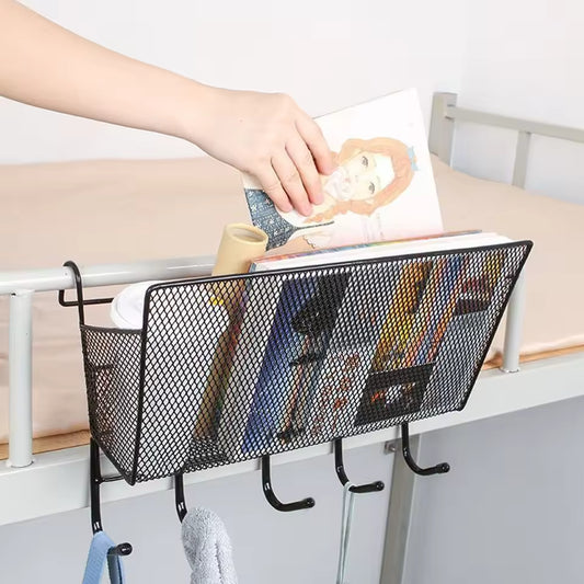Large capacity metal basket for bed by Clarify.pk holding books and hanging items on bed frame