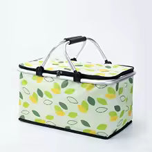 Large foldable picnic basket with green and yellow leaf pattern and sturdy handle for easy carrying