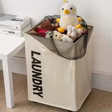 Clarify.pk laundry storage basket in white with black mesh lid holding stuffed toys