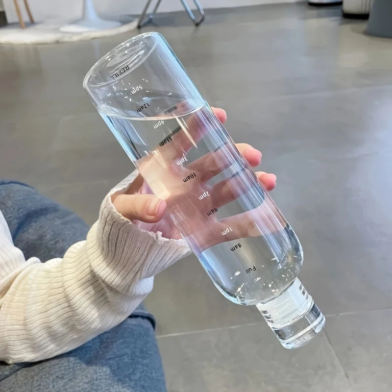 Clarify.pk clear leakproof sport water bottle held by hand with measurement markings