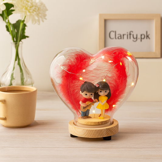 LED couple decoration lamp with heart-shaped glass and figurines of a boy playing guitar and girl in yellow dress
