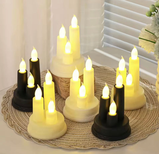 Set of black and white LED flameless candle for home decor with warm glowing flames on a woven mat