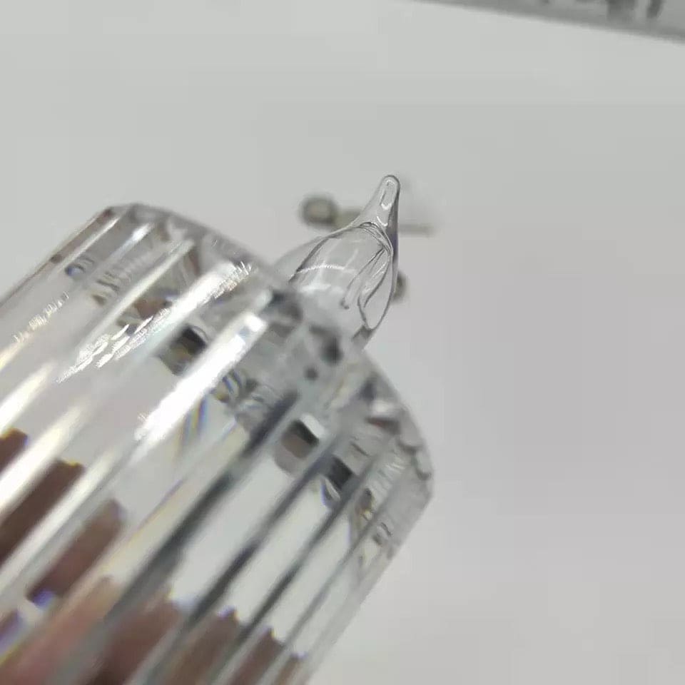 Close-up of a clear glass bulb part for an LED flameless candle lamp by Clarify.pk