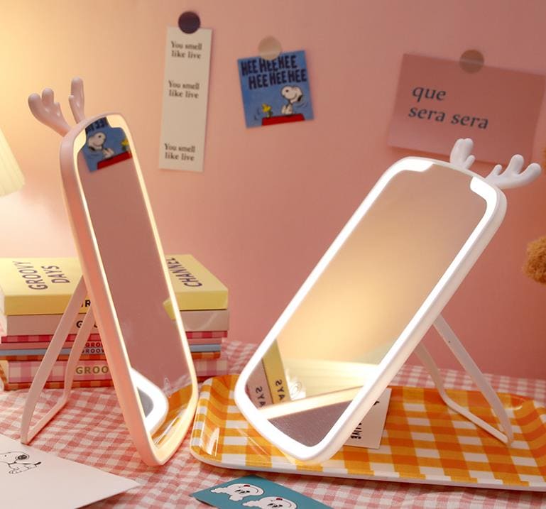 Clarify.pk LED makeup mirror with lights featuring cute antler design on a checkered table