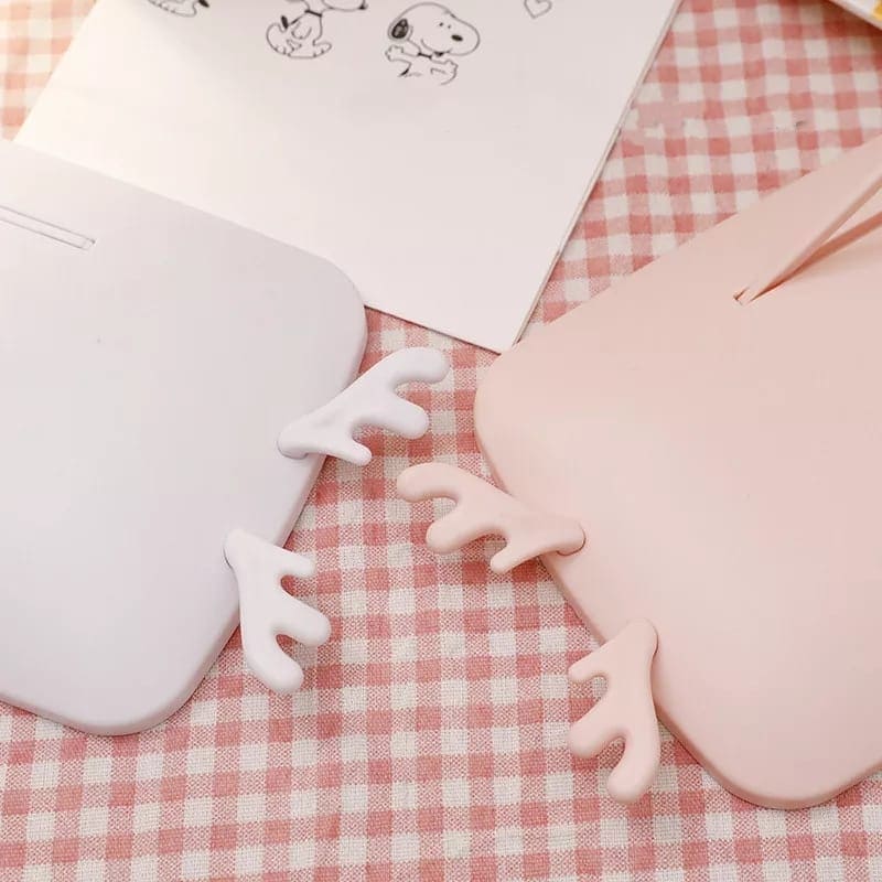 White and pink LED makeup mirror with lights featuring cute antler-shaped handles on checkered fabric