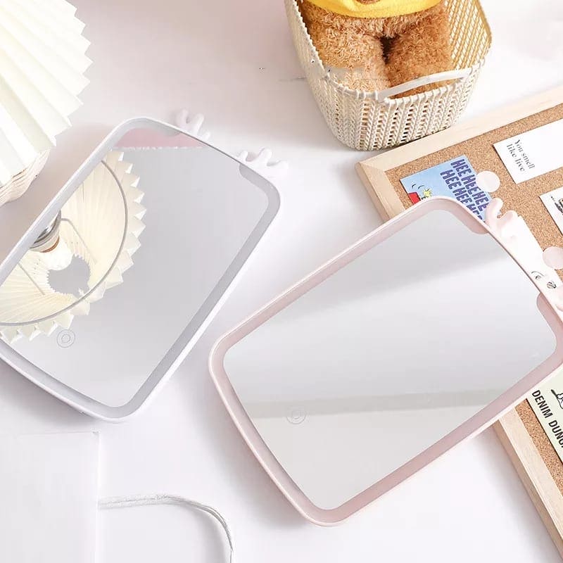 Clarify.pk LED makeup mirror with lights in white and pink frames on a white desk