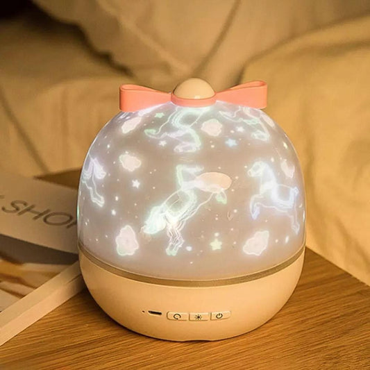 Cute LED night light projector with unicorn and cloud designs in soft pink and beige colors