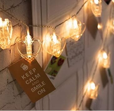 Clarify.pk warm glowing LED photo clip string lights with heart-shaped clips holding photos and cards