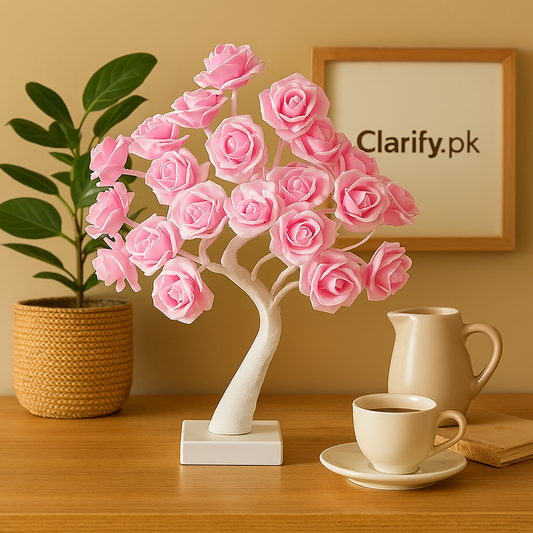 Pink LED rose flower lamp shaped like a blooming tree on a wooden table with a cup and pitcher