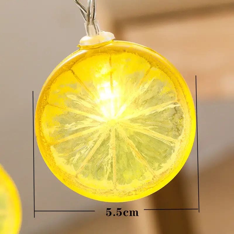 Close-up of a glowing lemon slice string lights bulb measuring 5.5 cm in diameter