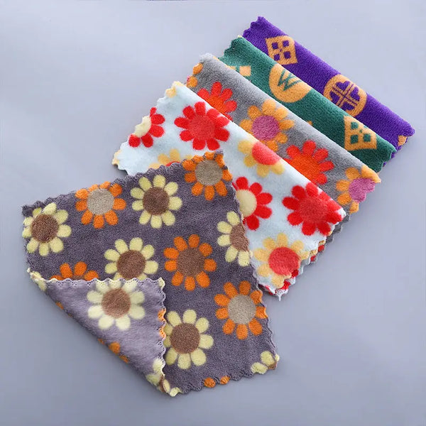 Stacked colorful floral cotton face towels with sunflower motifs in gray white green purple soft absorbent cloths