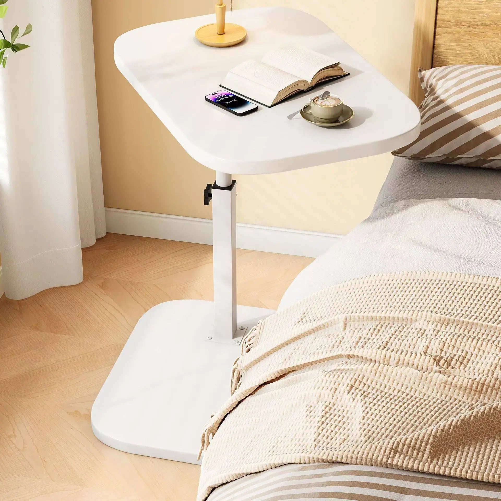 White lifting side table for living room with adjustable height and modern design beside a bed