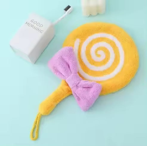 Yellow and white lollipop design bathroom towel with purple bow on blue background by Clarify.pk