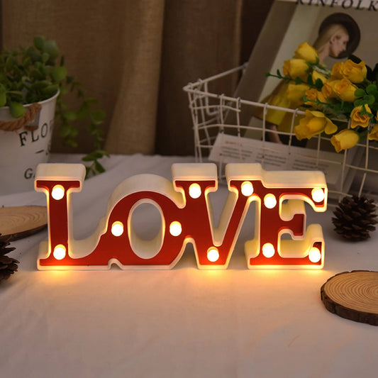 Illuminated love marquee lights for bedroom with warm white bulbs on red letters decoration