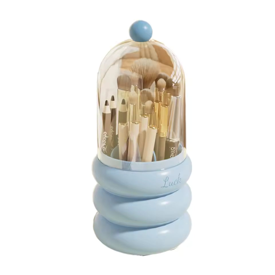 Blue dustproof makeup organizer with lid holding assorted makeup brushes and pencils
