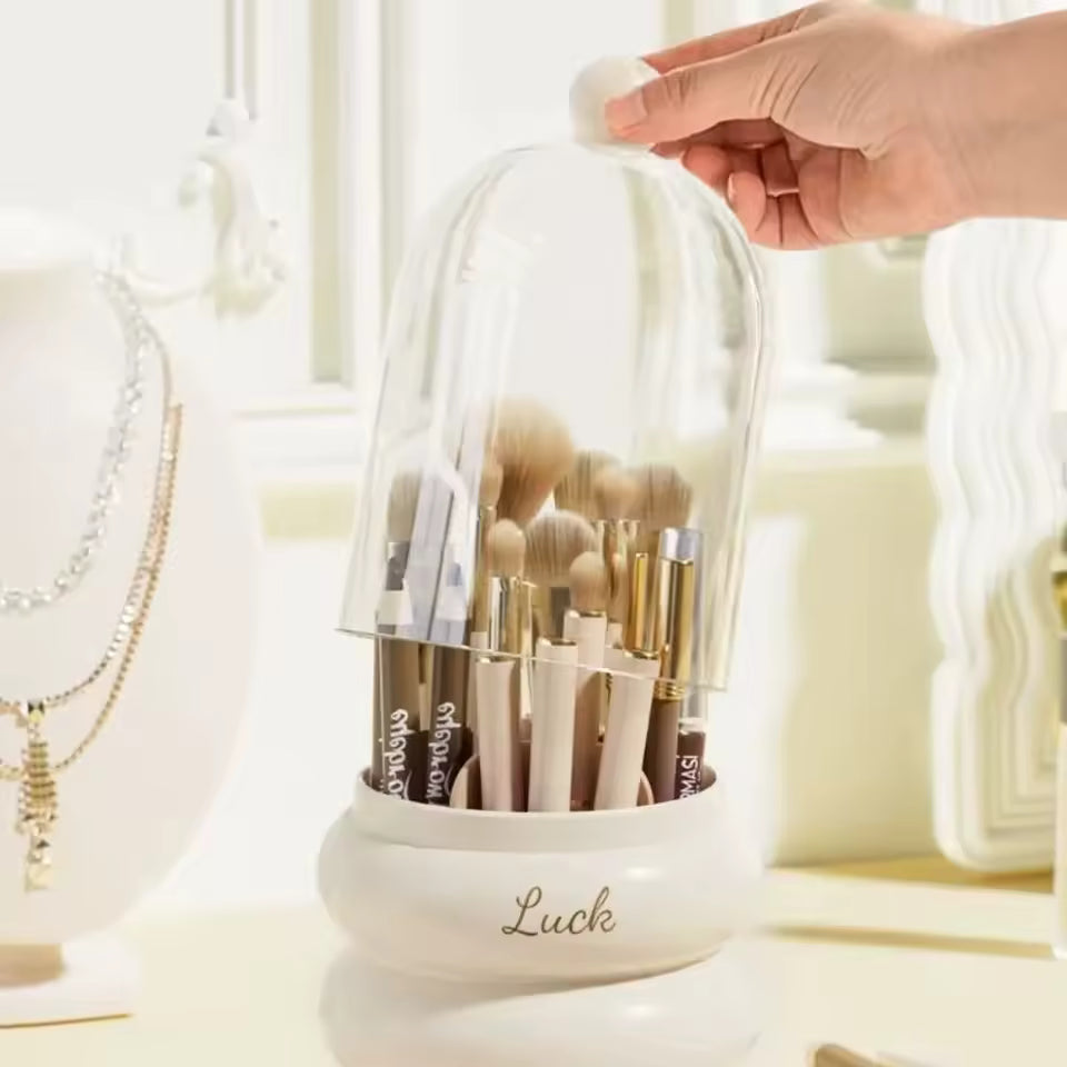 Dustproof makeup organizer with lid holding various makeup brushes and tools on white base