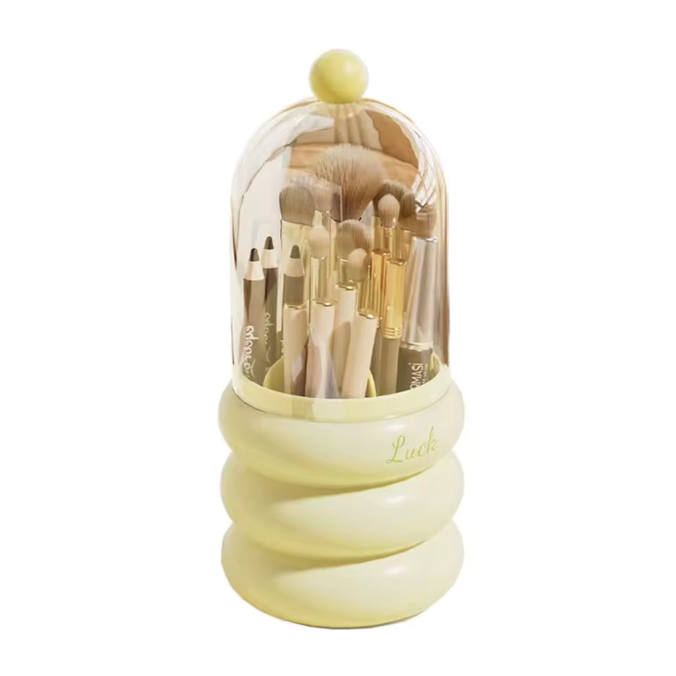 Dustproof makeup organizer with lid in cream color holding various makeup brushes and pencils