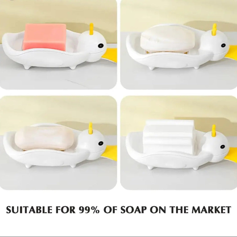 Cartoon duck soap dish in white holding various soap bars, designed by Clarify.pk for bathroom use