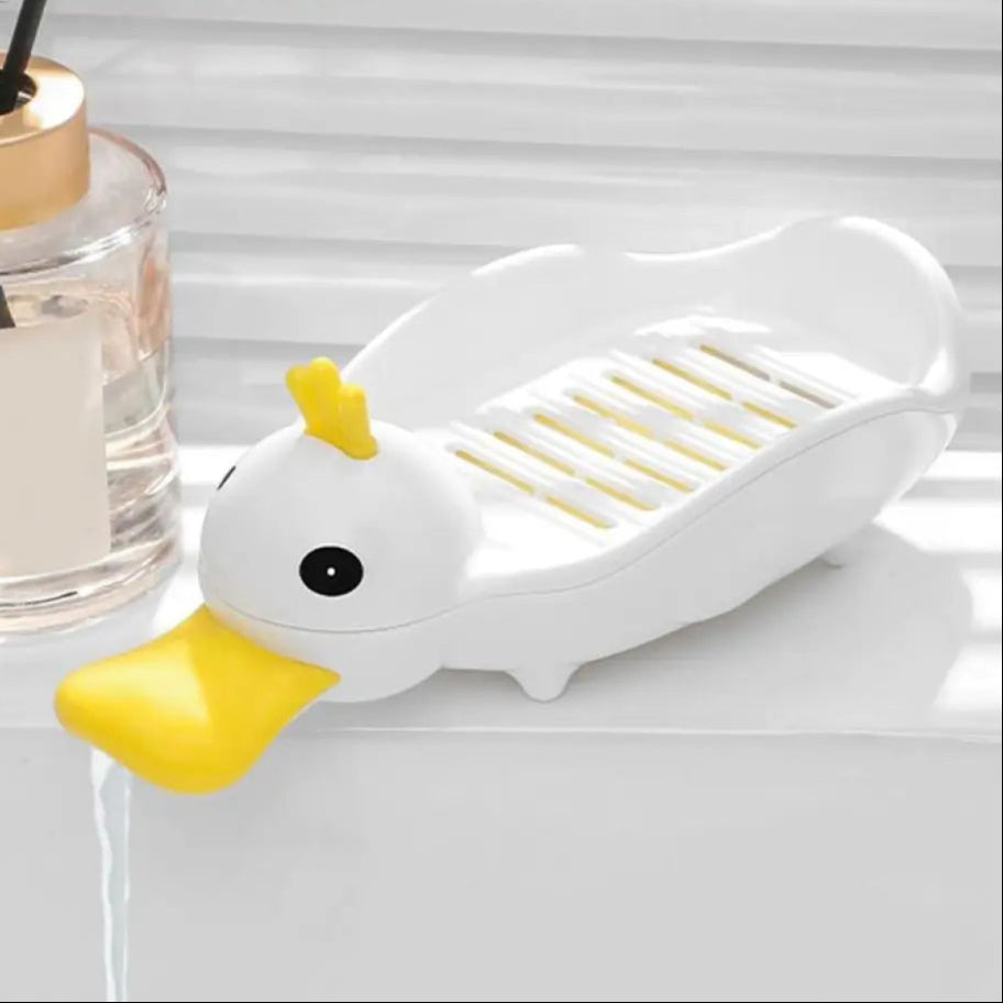 White and yellow cartoon duck soap dish with drainage slots for bathroom countertop
