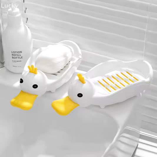 Clarify.pk cartoon duck soap dish in white with yellow beak holding soap by the sink